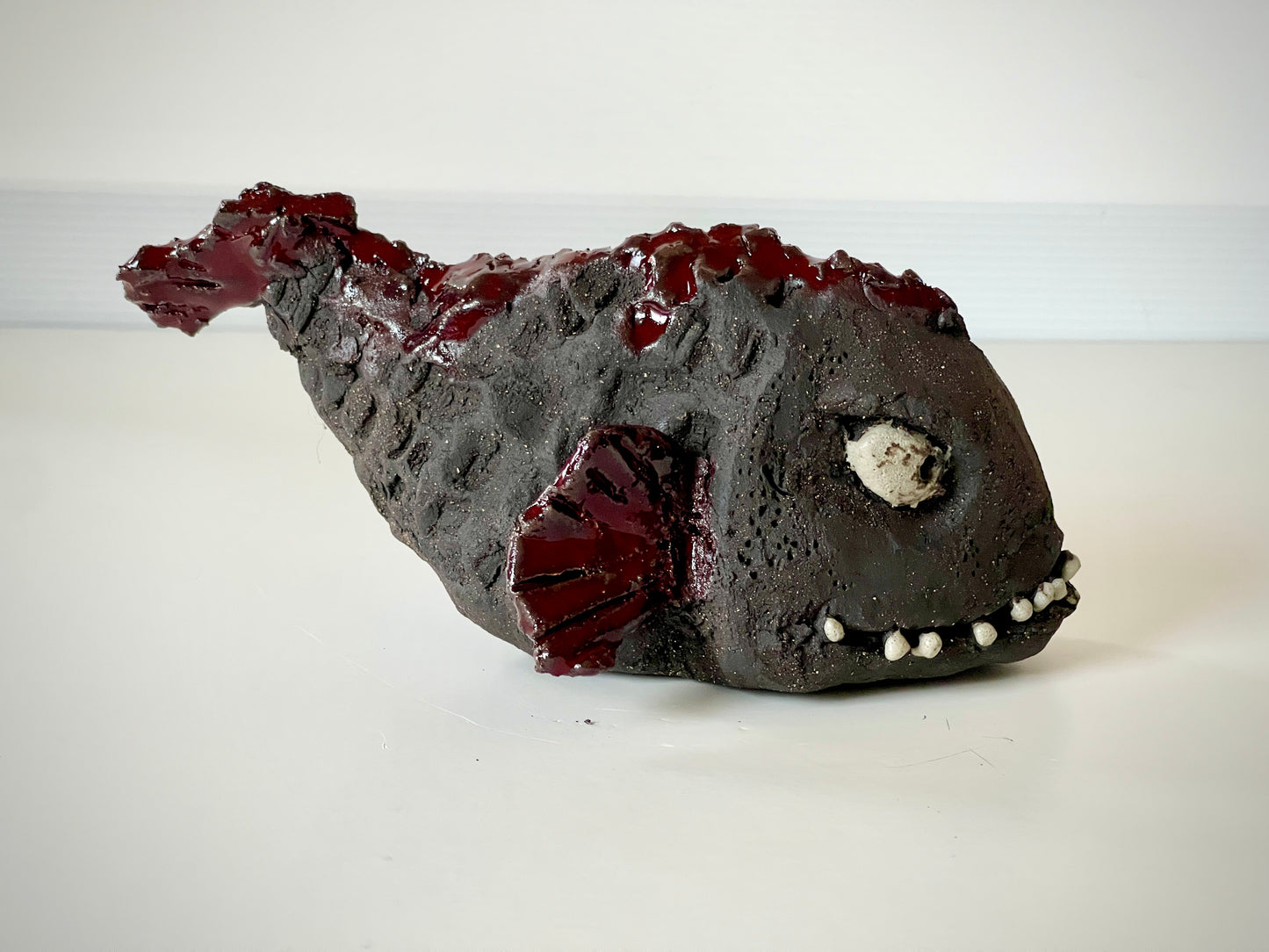 Steinbit skulptur- Luring